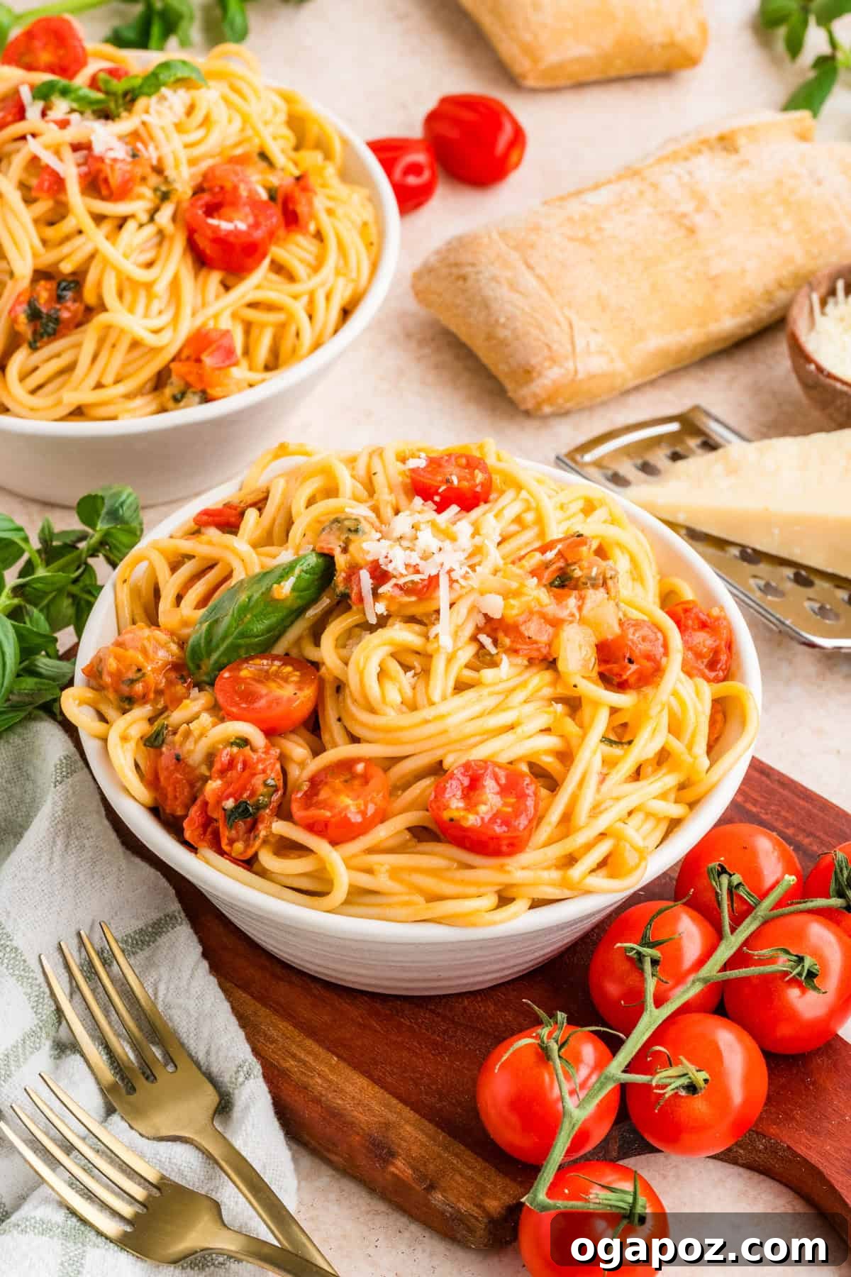 Fresh Cherry Tomato and Basil Pasta Recipe 11 Close up of cherry tomato pasta with glossy tomato sauce and fresh basil leaves