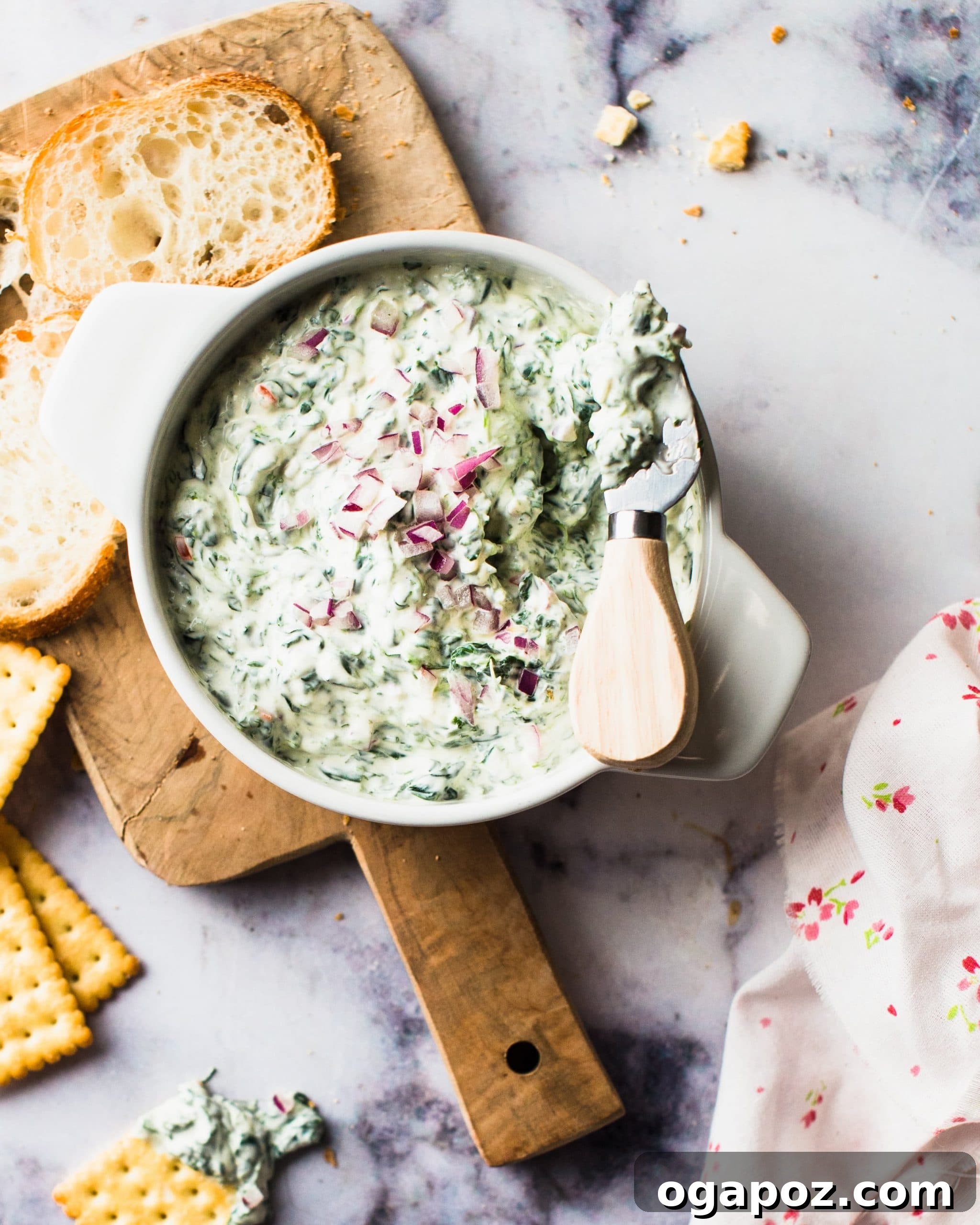 32 Crowd-Pleasing Cookout Appetizers for Summer 2 Sour cream spinach dip, an easy cookout appetizer, served with chips.