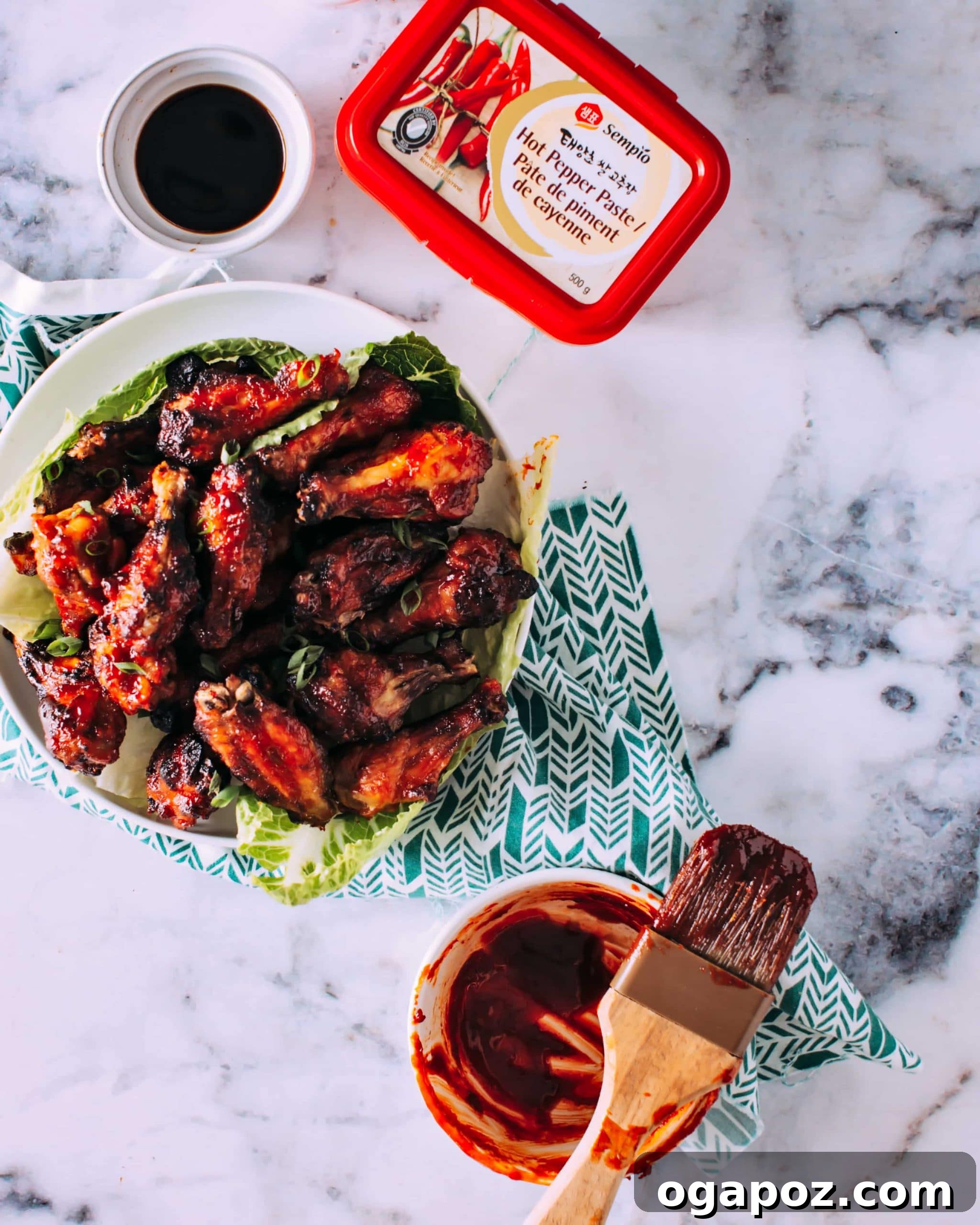 32 Crowd-Pleasing Cookout Appetizers for Summer 13 Sticky-spicy Korean chicken wings piled on a platter.