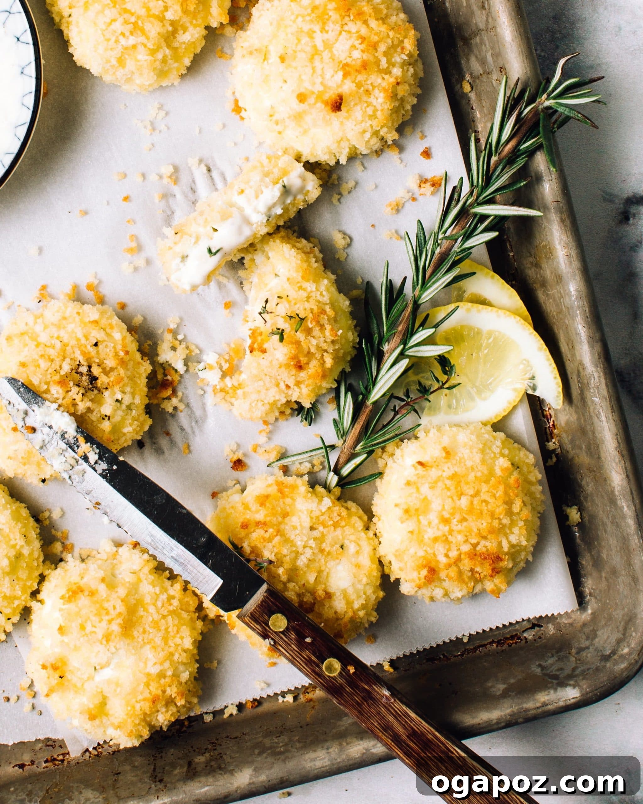 32 Crowd-Pleasing Cookout Appetizers for Summer 27 Herbed baked goat cheese fritters on a serving platter.