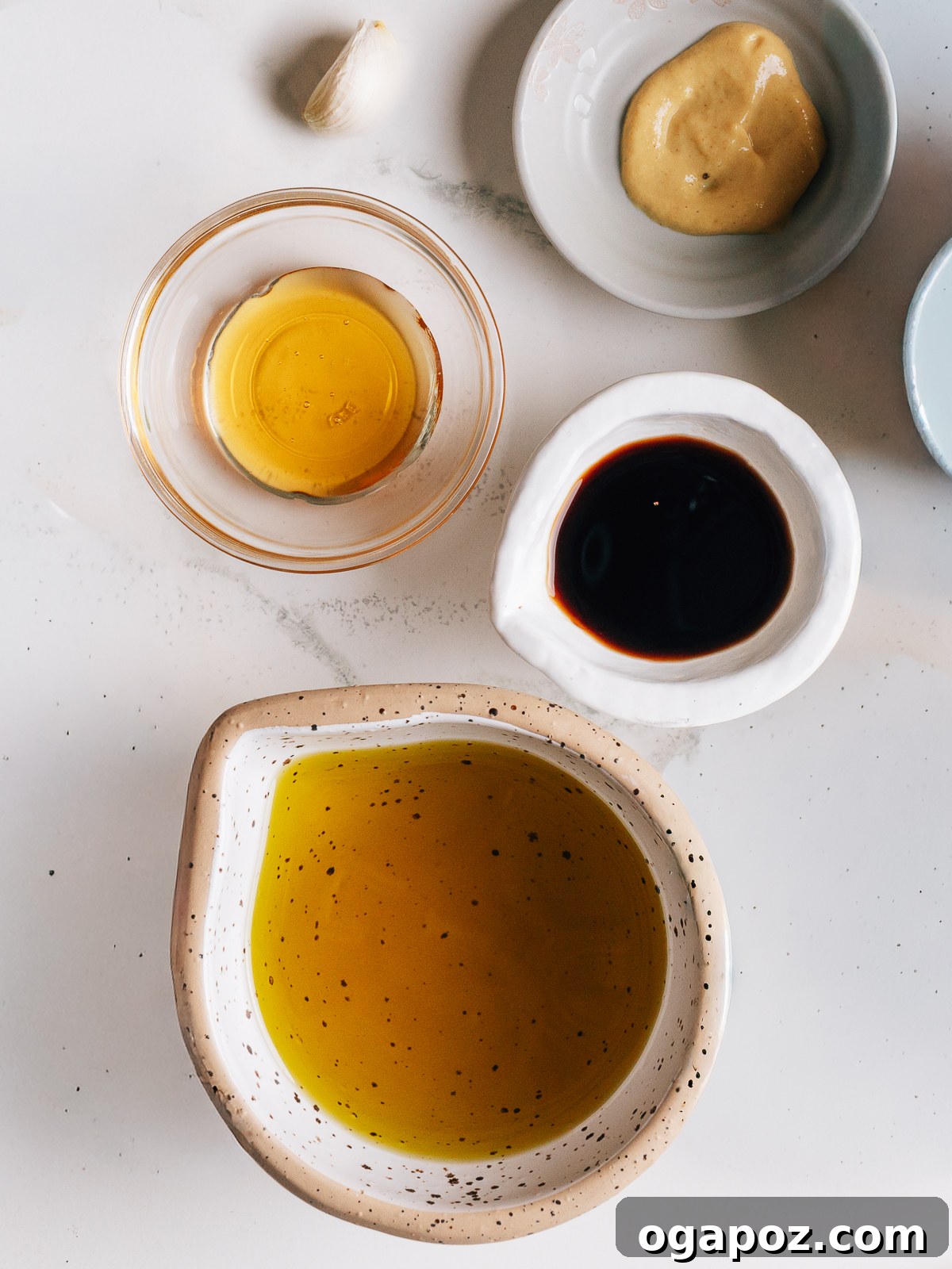 Classic Homemade Balsamic Vinaigrette Recipe 3 Ingredients for balsamic vinaigrette on a counter.