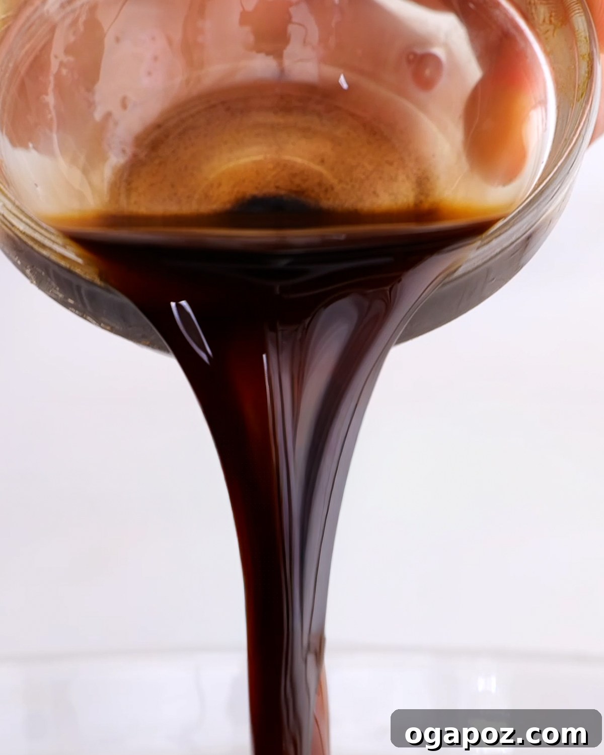 Classic Homemade Balsamic Vinaigrette Recipe 7 Homemade balsamic vinaigrette dressing being poured out.
