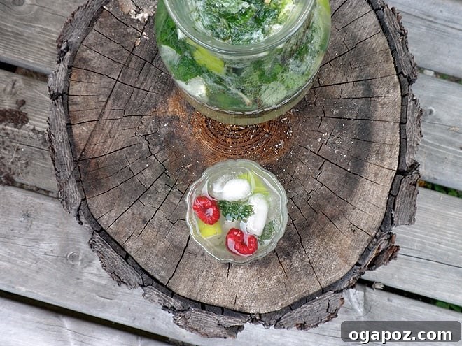 16 Summer Drink Recipes: Alcoholic and Non-Alcoholic Refreshers 5 Classic mint mojitos with lime wedges and fresh mint over ice.