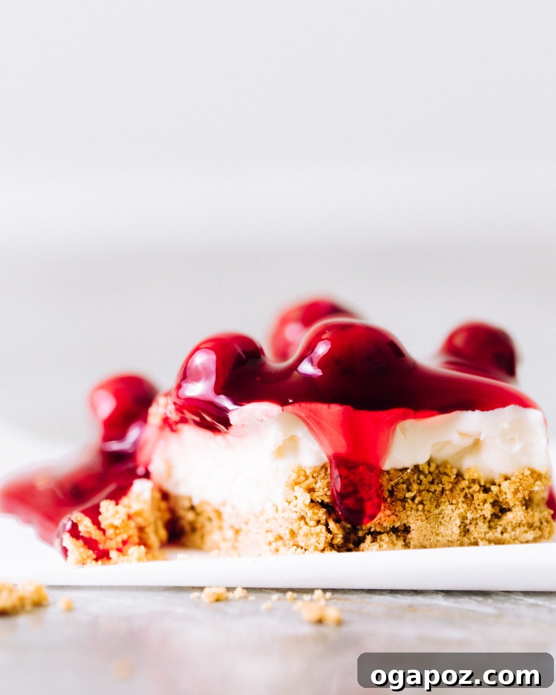 Summer Fruit Dessert Recipes: Peach, Cherry and Berries 26 No-bake cherry cheesecake bars cut into squares.