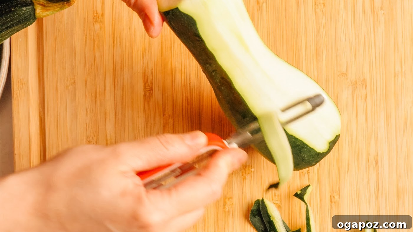 Crisp Raw Zucchini Ribbon Salad with Lemon and Herbs 5 Shaving zucchini into thin ribbons with a vegetable peeler.