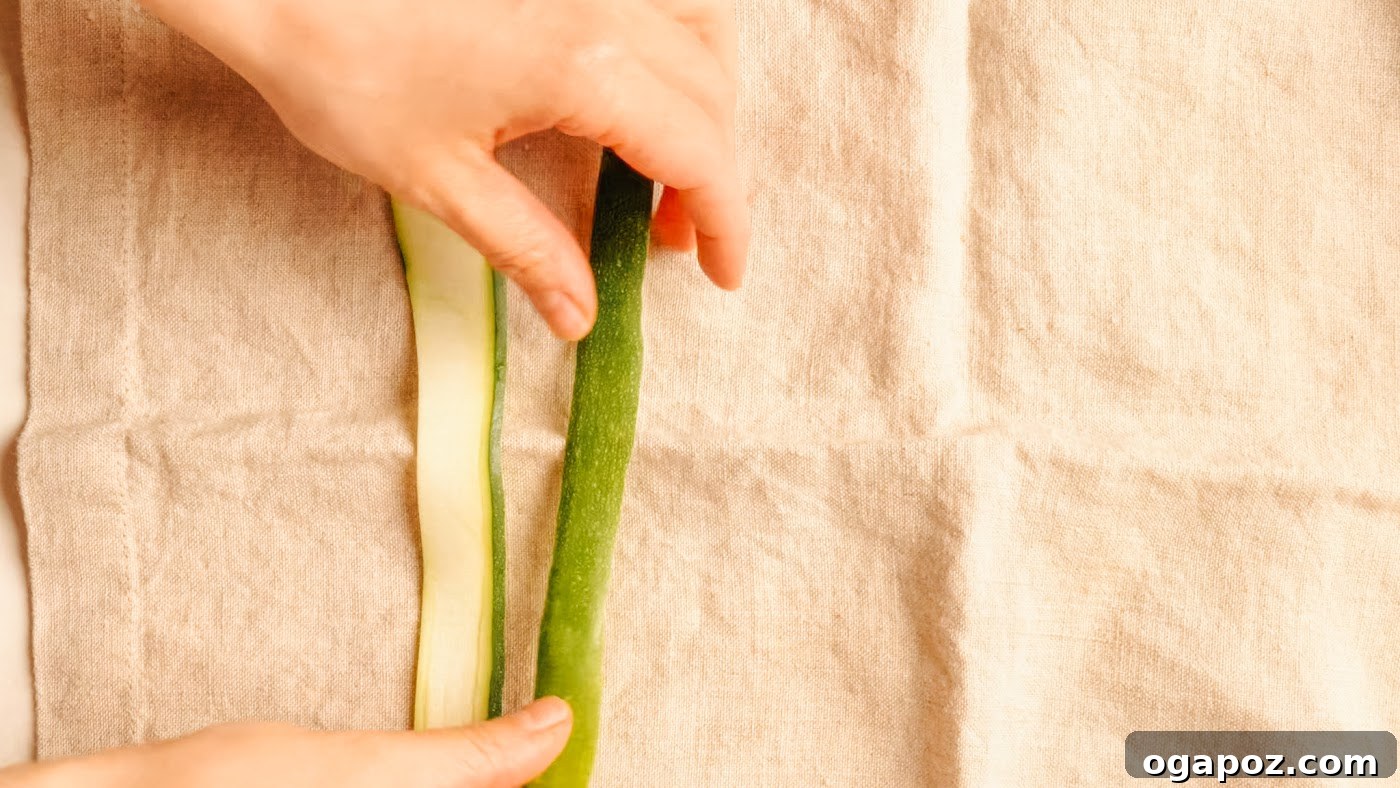 Crisp Raw Zucchini Ribbon Salad with Lemon and Herbs 7 Blotting shaved zucchini ribbons dry on a tea towel.