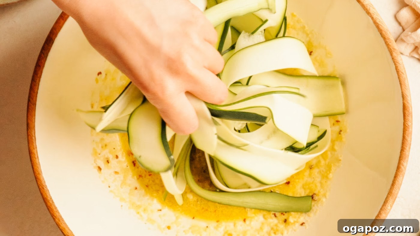 Crisp Raw Zucchini Ribbon Salad with Lemon and Herbs 8 Tossing zucchini ribbons with dressing and fresh herbs.