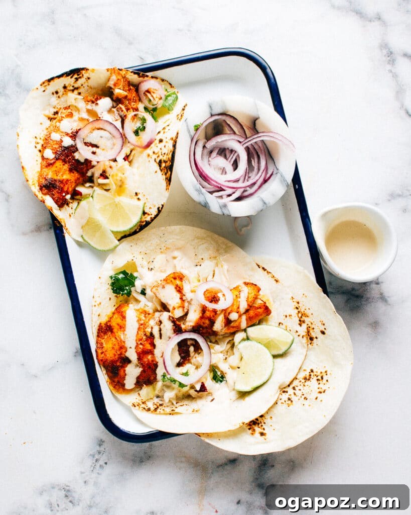 Spicy fish tacos with cabbage slaw and lime crema.