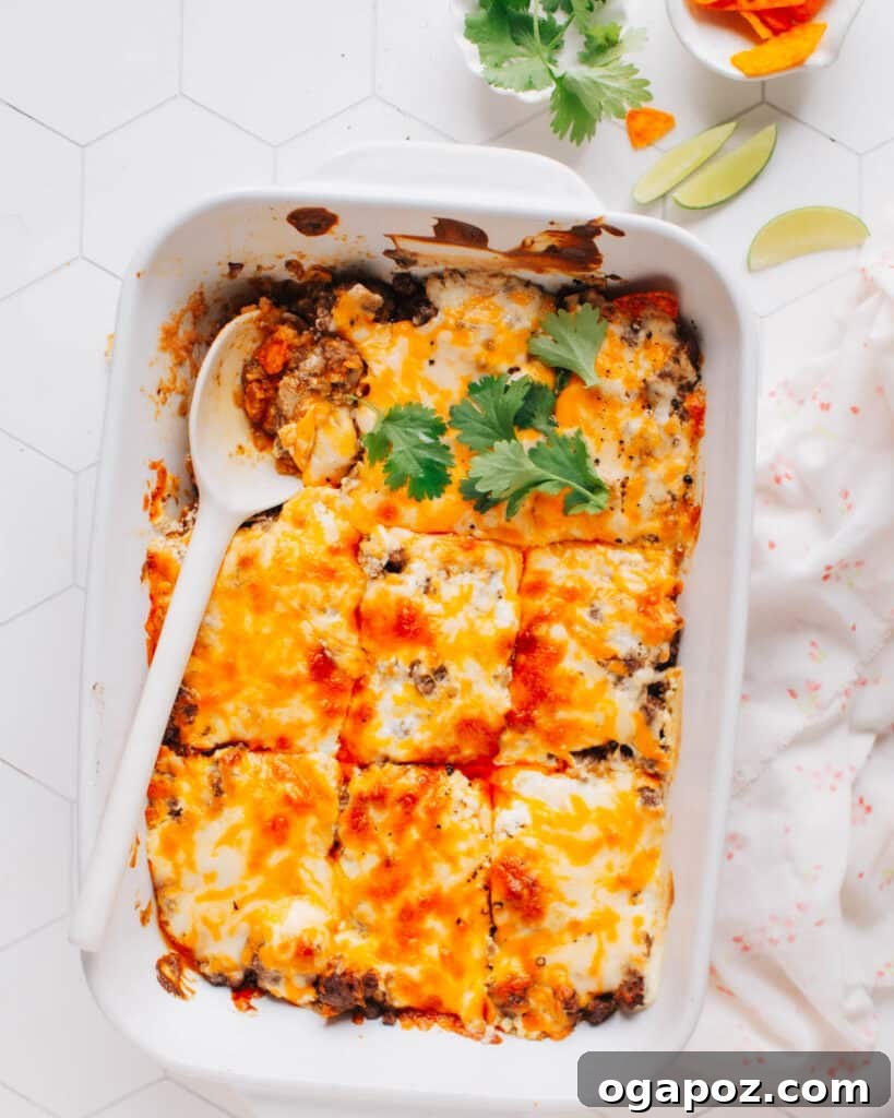 Walking taco casserole with corn chips, beef, and cheese.