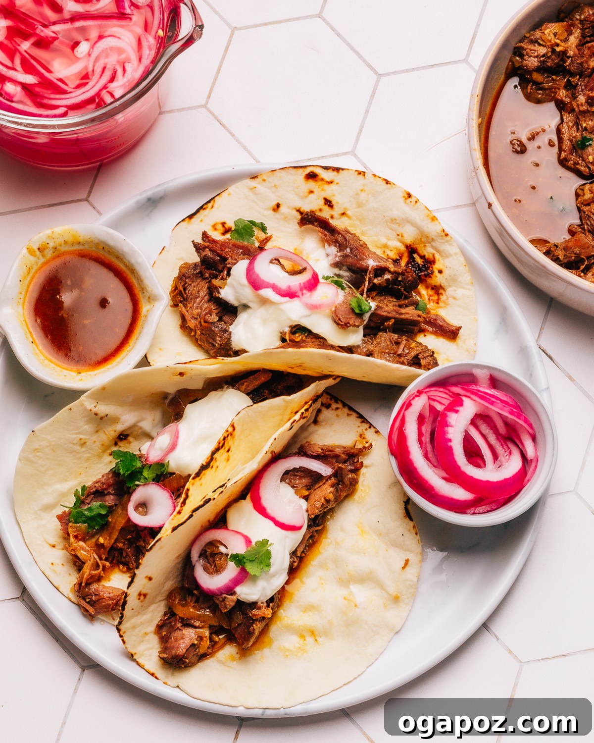 Shredded beef tacos on warm tortillas.