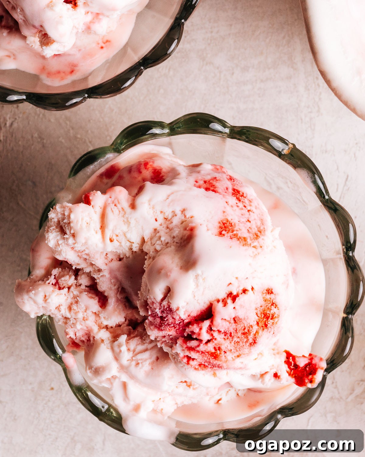 Creamy Homemade Strawberry Ice Cream Recipe 11 No Churn Strawberry Ice cream recipe scooped into bowls.