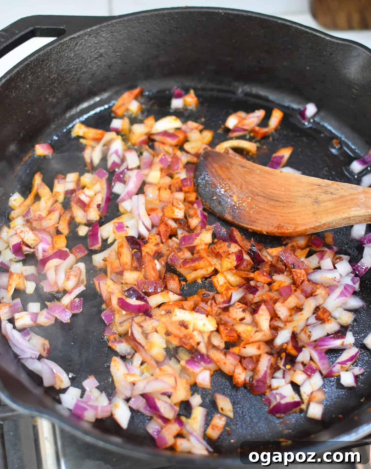 One-Pan Sausage and Vegetable Skillet 7 Onion and Spices in a skillet