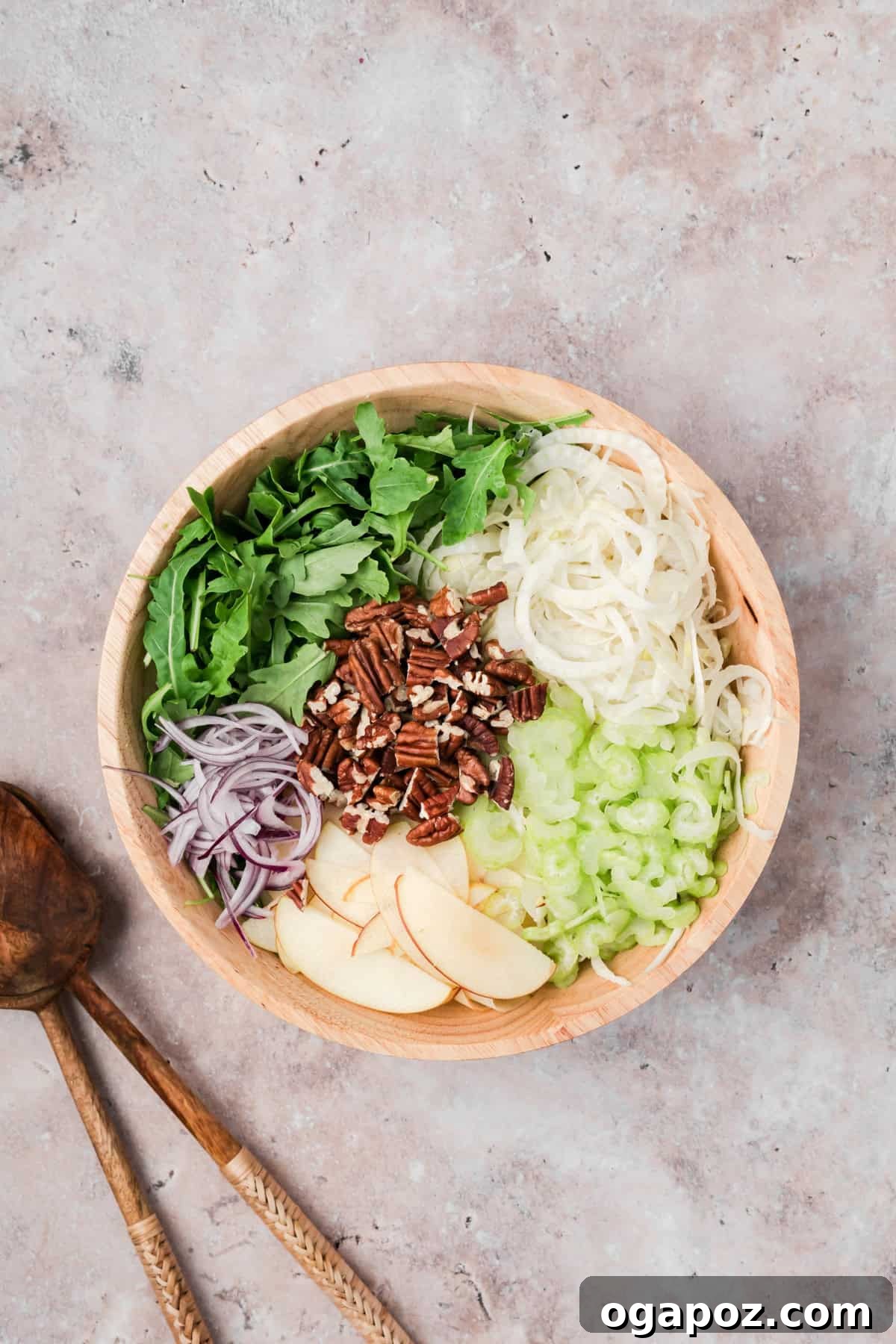 Crisp Apple and Fennel Salad with Lemon Vinaigrette 9 Easy Apple Fennel Salad mixing ingredients in a bowl