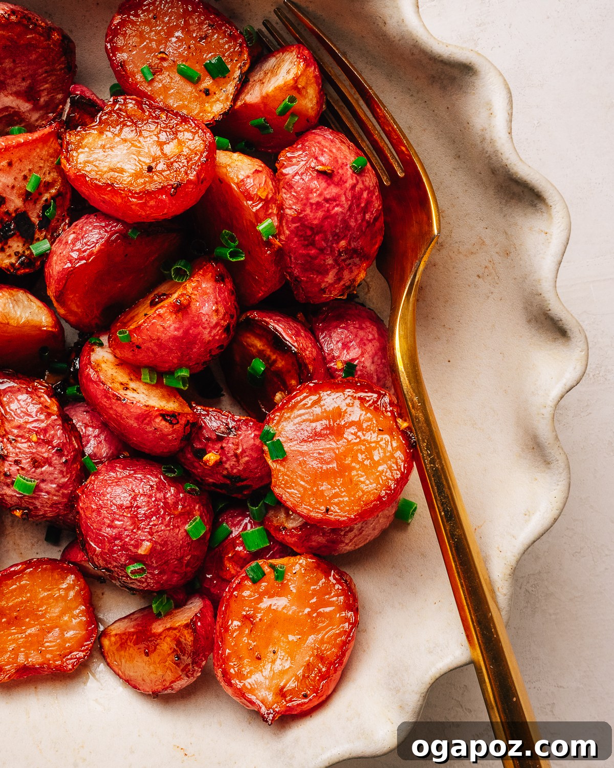 Crispy Oven-Roasted Radishes with Garlic and Herbs 9 Roasted Radishes in a dish with a fork.