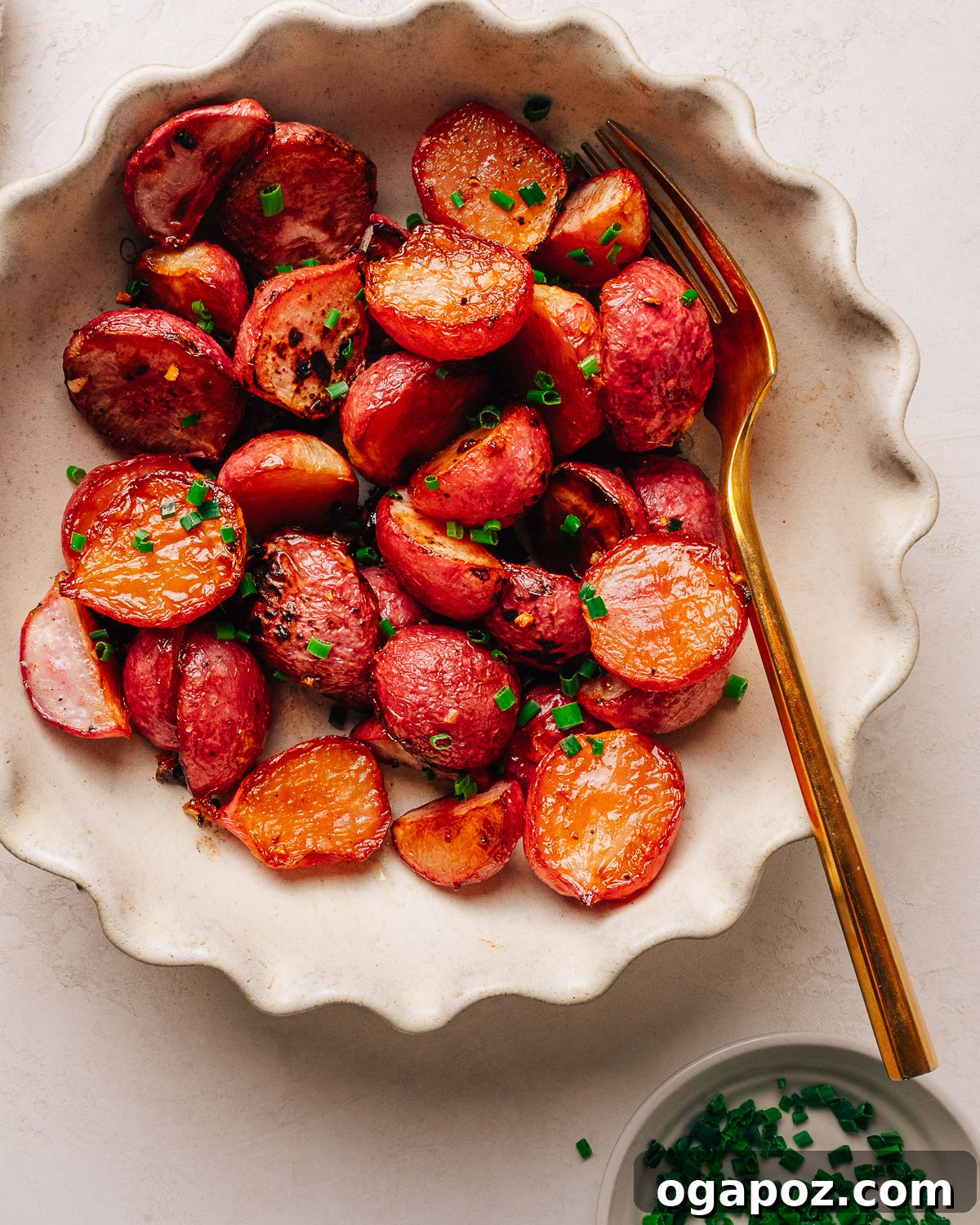 Crispy Oven-Roasted Radishes with Garlic and Herbs 10 A dish of roasted radishes with a fork.