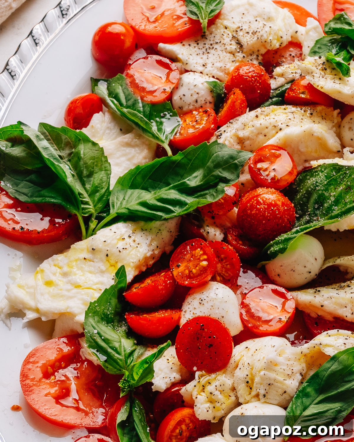 20 Fresh Tomato Recipes to Use Up Ripe Tomatoes 2 A platter of caprese salad made with ripe cherry tomatoes, fresh mozzarella and basil.