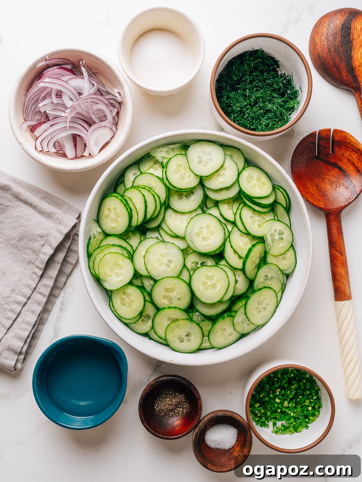 Cucumber Dill Salad with Vinegar Dressing 3 Dill Vinegar Cucumber Salad Ingredients laid out on a counter.