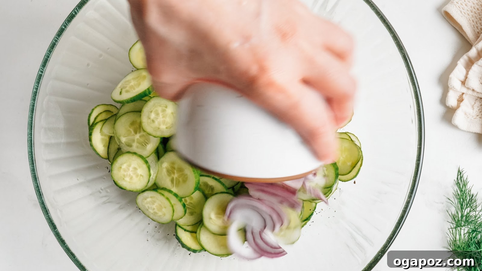 Cucumber Dill Salad with Vinegar Dressing 5 Adding thinly sliced cucumbers to the vinegar dressing.