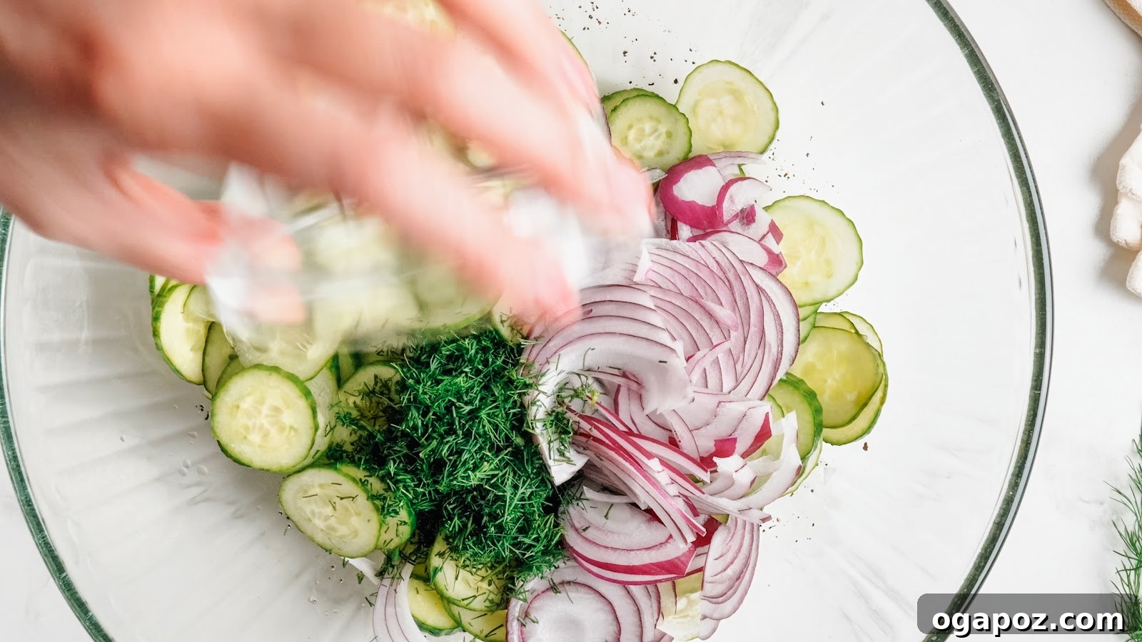 Cucumber Dill Salad with Vinegar Dressing 6 Adding fresh dill and red onion to the cucumbers.