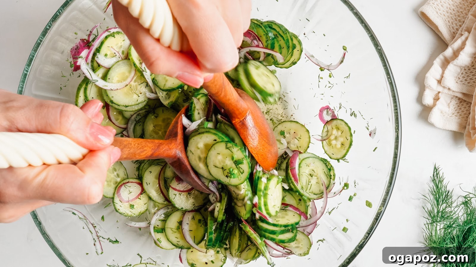 Cucumber Dill Salad with Vinegar Dressing 7 Tossing the cucumber dill salad to coat every slice.