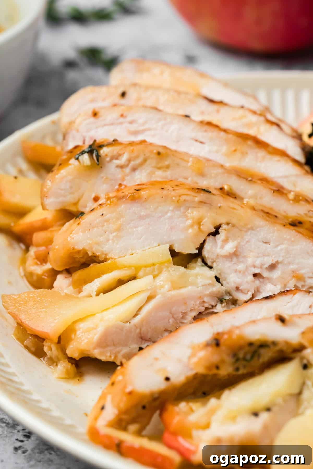 Apple and Brie Stuffed Chicken Breast Recipe 12 Sliced section of apple and brie stuffed chicken with maple Dijon glaze