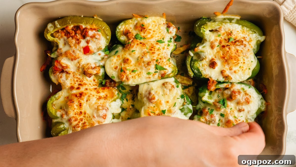 Classic Stuffed Green Peppers with Rice and Ground Beef 10 Baked stuffed green peppers topped with golden cheese.