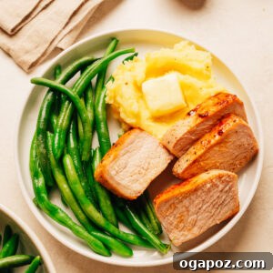 Oven-Baked Brown Sugar Boneless Pork Chops 10 Juicy baked boneless pork chops on a plate.