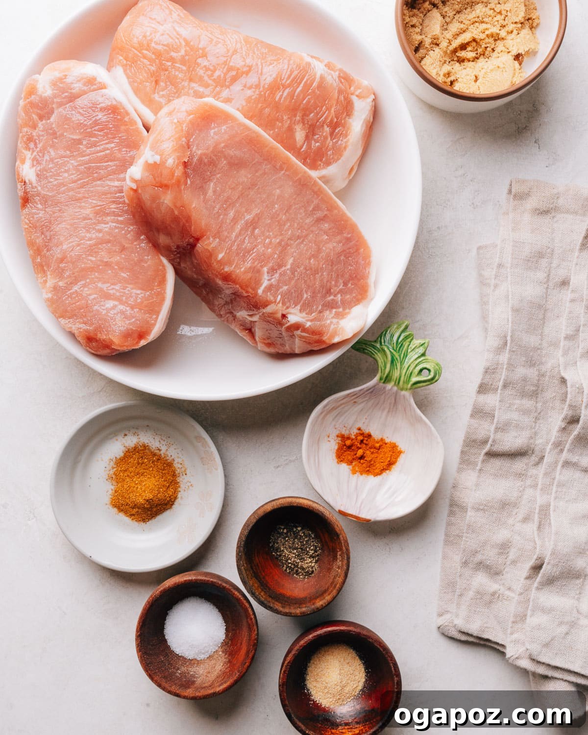 Oven-Baked Brown Sugar Boneless Pork Chops 3 Sliced baked boneless pork chops showing a tender, juicy interior.