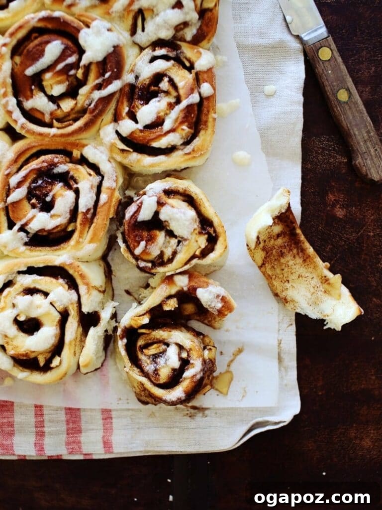 21 Unexpected Apple Recipes Beyond Pie 11 Soft cinnamon rolls filled with apple pie filling in a baking dish.