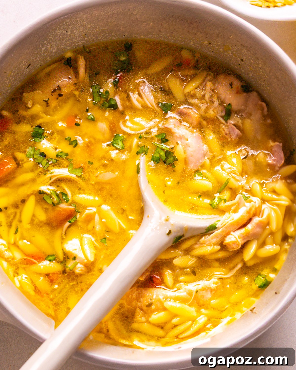 57 Simple Soup Recipes to Warm Your Soul 3 Lemon chicken orzo soup with fresh dill and orzo pasta in a bowl.