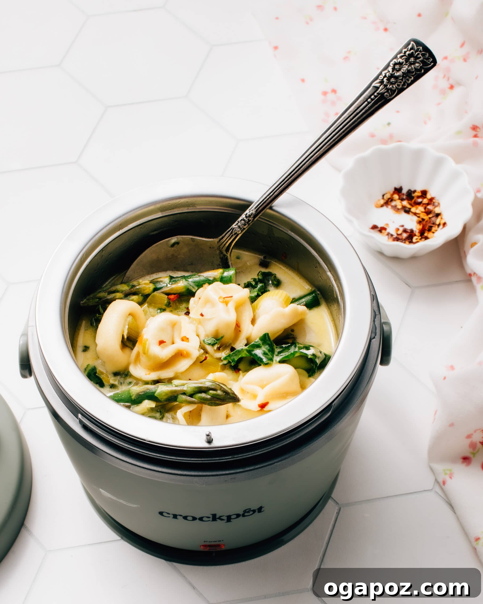 57 Simple Soup Recipes to Warm Your Soul 21 Vegetarian crockpot tortellini soup with greens and cheese tortellini.