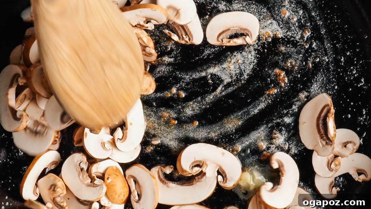 Creamy One-Pan Chicken Stroganoff 6 Sliced cremini mushrooms spread in an even layer to brown.