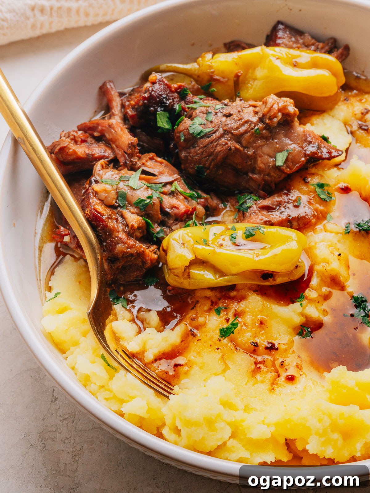 Slow-Cooker Mississippi Pot Roast Recipe for Tender, Flavorful Meat 11 Shredded Mississippi pot roast in its buttery pan juices with pepperoncini peppers.