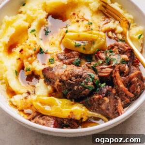 Slow-Cooker Mississippi Pot Roast Recipe for Tender, Flavorful Meat 12 Mississippi pot roast served over mashed potatoes with whole pepperoncini and parsley.