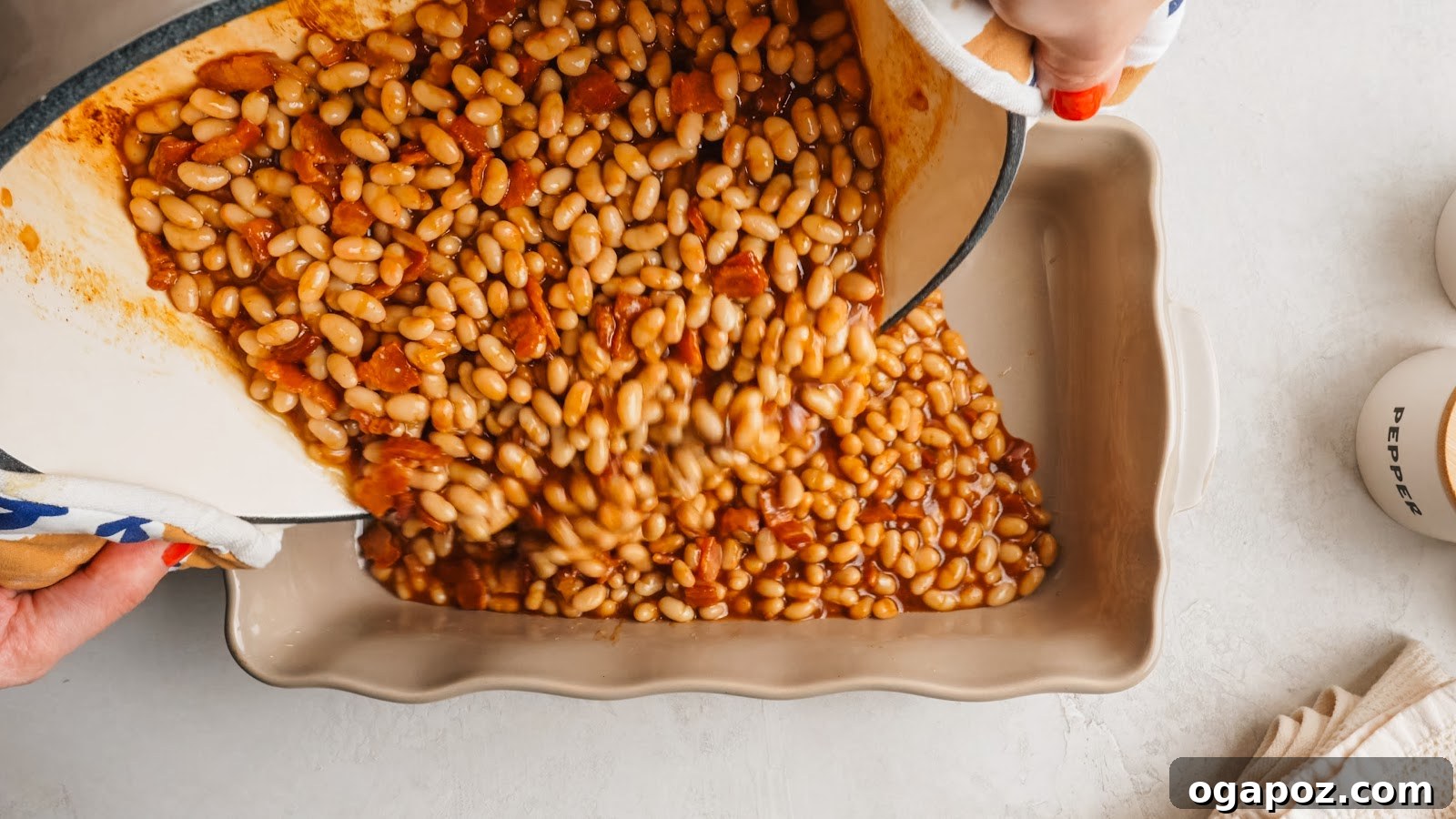 The beans spread into a 9x13 baking dish before baking.