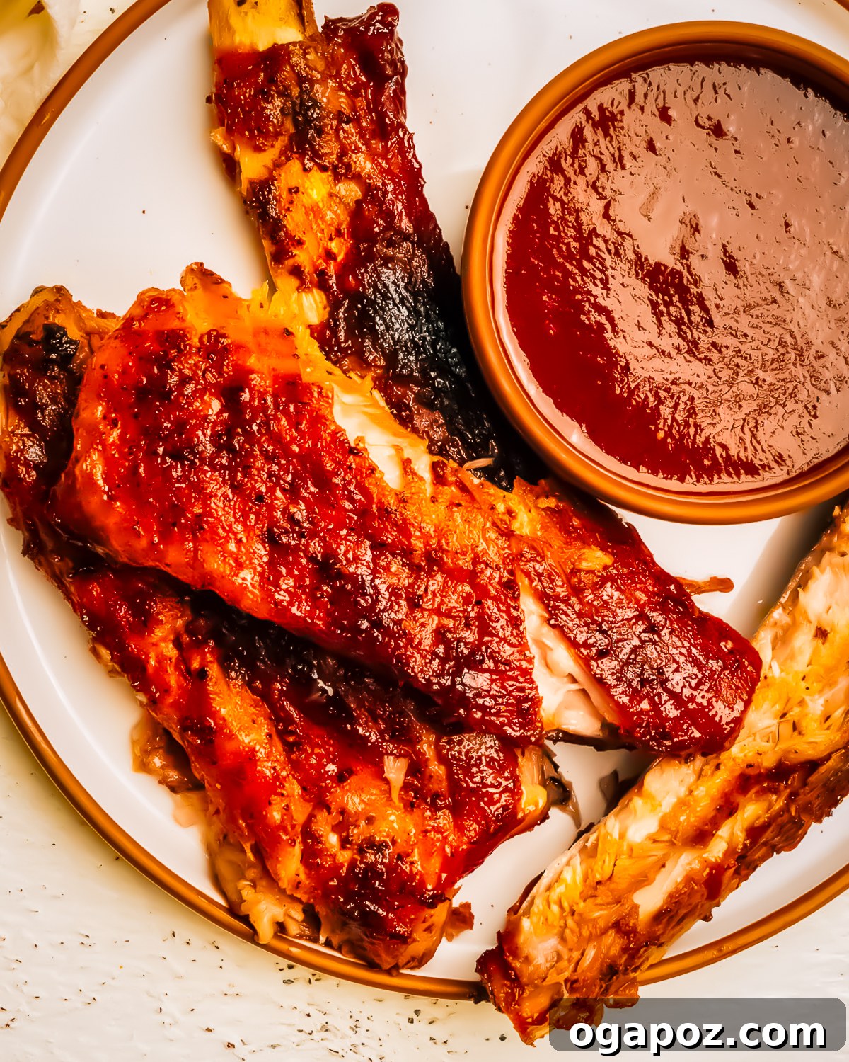 Homemade Award-Winning Brown Sugar BBQ Sauce 2 Brown sugar bbq sauce in a bowl with ribs.