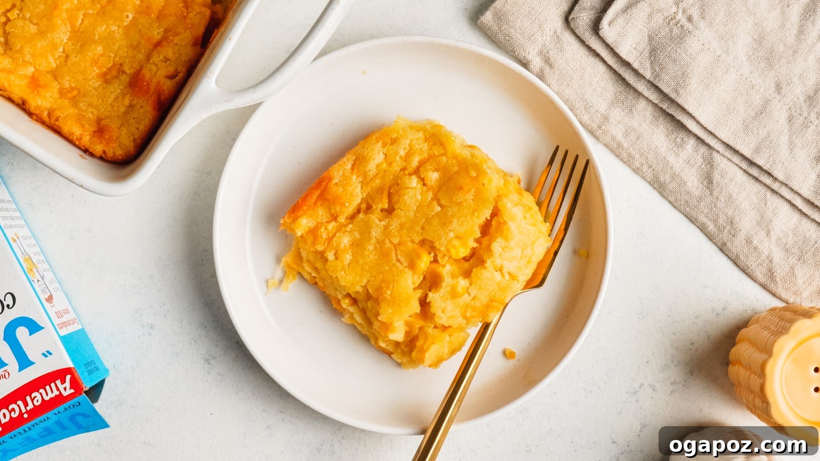 Served square of corn casserole on a plate