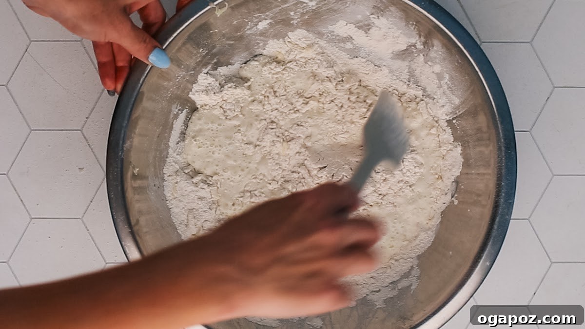 Stirring the biscuit topping for easy peach cobbler.